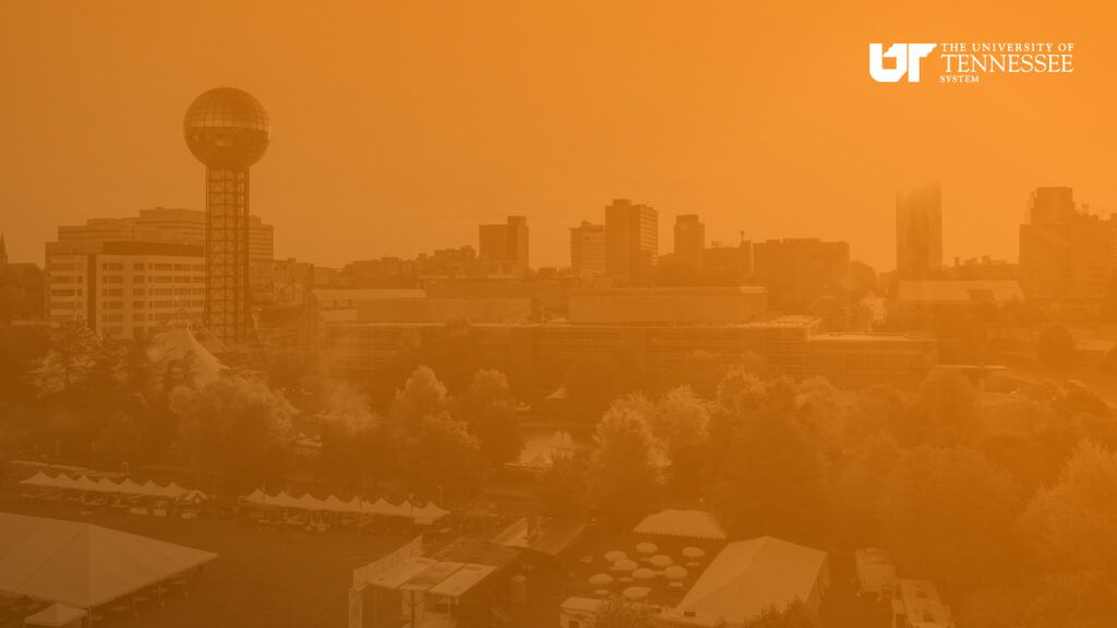 Orange overlayed image of downtown Knoxville with white UT System logo.